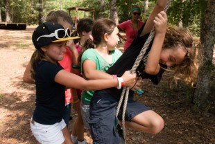 Camp Kesem campers enjoy the low ropes course.