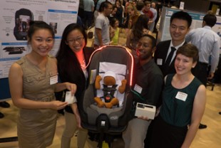 Rice engineers pose with their car seat accessory, Infant SOS.