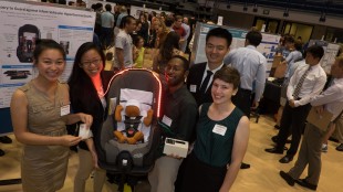 The Infant SOS team showcases their car seat accessory.