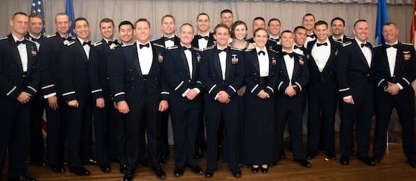 Three Rice alumni, all of whom earned master's degrees in the lab of Professor Tayfun Tezduyar, are among the most recent graduates of the Air Force Test Pilot School. Pictured with their fellow classmates are Capt. Darren Montes '12, fourth from left; Capt. Ryan Kolesar '14, 12th from left; and Maj. Samuel Wright '10, fifth from right. Photo by Joe Jones/U.S. Air Force