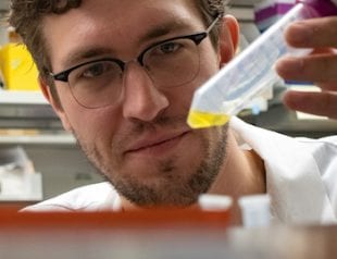 Rice graduate student Josh Atkinson is lead author of a study to develop protein switches that can be used to control the flow of electrons within cells. Photo by Jeff Fitlow