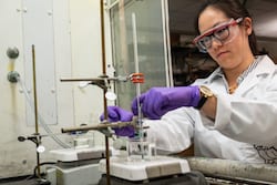 Rice University graduate student Kimmai Tran and her colleagues have developed an environmentally friendly solution to remove valuable cobalt and lithium metals from spent lithium-ion batteries. (Photo by Jeff Fitlow/Rice University)