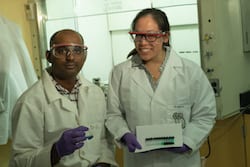 Rice University research scientist Babu Ganguli and graduate student Kimmai Tran show test tubes with their eutectic solvent and varying concentrations of cobalt drawn into the solution. They are developing the solvent to extract cobalt and lithium from spent lithium-ion batteries. (Photo by Jeff Fitlow/Rice University)