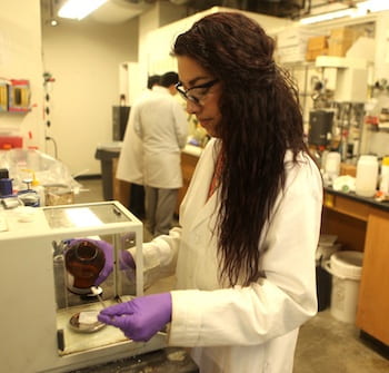 Graduate student Kimberly Mendoza modifies graphene quantum dots in the Rice lab. 