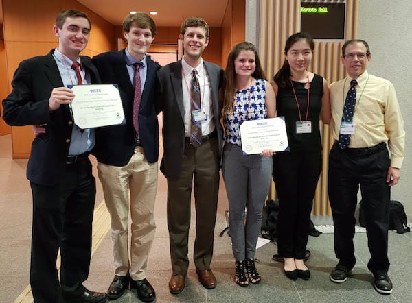 Rice University engineering students who developed a wireless recorder for intracranial epileptic seizure monitoring won the top prize at the IEEE Circuits and Systems Society student design competition in Sapporo, Japan. From left are students Andres Gomez, Aidan Curtis, Benjamin Klimko, Sophia D'Amico, and Zhiyang Zhang, and Joe Cavallaro, a Rice professor of electrical and computer engineering and of computer science. (Credit: Photo courtesy of Joe Cavallaro)