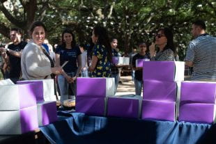 Kate Cross, associate dean of graduate and postdoctoral studies, shook hands and greeted students as they hauled off their prize desserts.