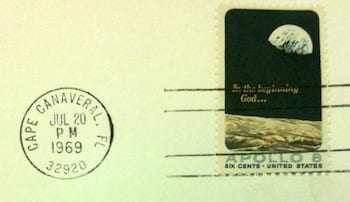 A cancelled stamp and postmark from the Curt Michel collection at Woodson mark the day of the first steps on the moon.