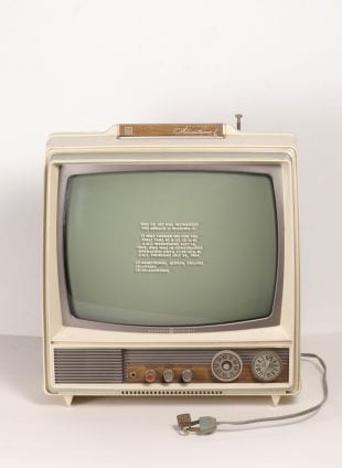 Siah Armajani, "Moon Landing," 1969. Multimedia Sculpture using stenciled television, lock and ink on five sheets of newspaper. Television with stencil: 13 1/2 × 12 1/2 × 9” ( 34.3 × 31.8 × 22.9 cm)