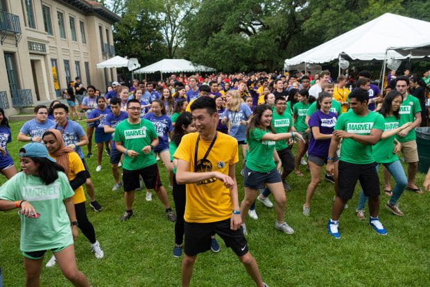 New freshmen enjoyed the traditional Texas pairing of line dancing and barbecue as President David Leebron and University Representative Y. Ping Sun, their dog Tex in tow, hosted the students at their home Aug. 19. (Photos by Jeff Fitlow)