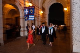 Martel College magisters Frank and Carrie Toffoletto led their new students through the Sallyport during matriculation. (Photo by Jeff Fitlow)