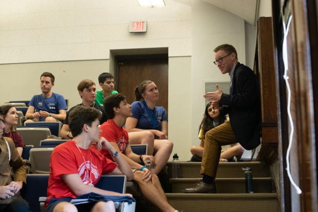 Caleb McDaniel, Duncan College magister and associate professor of history, chatted with freshmen following an Aug. 19 orientation session for the School of Humanities. 