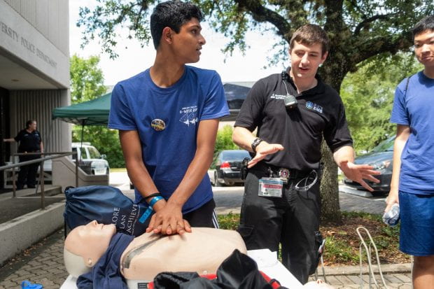 The award-winning student-run Rice Emergency Medical Services showed incoming freshmen how to perform CPR on dummies outside the Rice University Police Department Aug. 20.