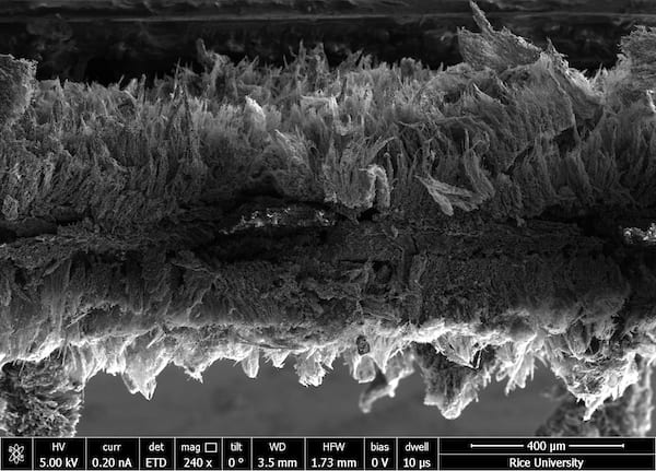 Seen in an electron microscope image, micron-scale sheets of graphene created at Rice University form a two-layer air filter that traps pathogens and then kills them with a modest burst of electricity. (Credit: Tour Group/Rice University)