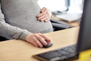 Pregnant woman at work. Photo by 123rf.com