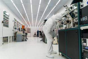 A graduate student at work in Rice University's clean room