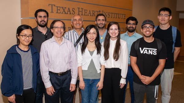 Members of the team that will continue to develop leadless, wirelessly powered pacemakers gathered at Texas Heart Institute. From left, front: Yang Zhao, Joseph Cavallaro, Yingyan Lin, Allison Post, Anton Banta; and back, Romain Consentino, Behnaam Aazhang, Dr. Mehdi Razavi, Mathews John and Yue Wang. Credit: Texas Heart Institute