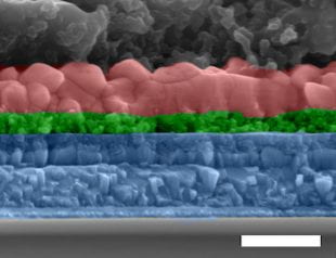 An electron microscope image shows a cross-section of the all-inorganic perovskite solar cell developed at Rice University. From top, the layers are a carbon electrode, perovskite, titanium oxide, fluorine-doped tin oxide and glass. (Credit: Lou Group/Rice University)