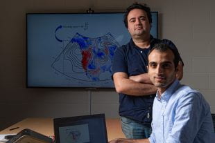 Rice University researchers Ebrahim Nabizadeh (seated) and Pedram Hassanzadeh
