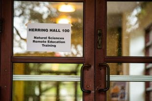 A sign indicates remote-learning training is underway at Herring Hall. (Photo by Jeff Fitlow)