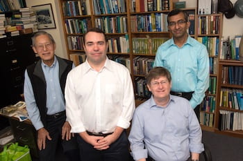 Rice University researchers — from left, George Hirasaki, Philip Singer, Walter Chapman and Dilip Asthagiri — have put to rest a long-held theory about the use of nuclear magnetic resonance to detect oil and gas deposits in the nanoscale pores of shale formations. Missing from the photo is the study’s lead author, Arjun Valiya Parambathu. (Credit: Jeff Fitlow/Rice University)