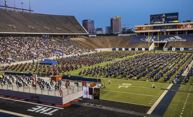 Rice Class of 2021 graduates fill the field at Rice Stadium.
