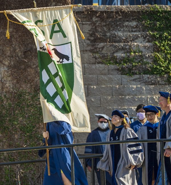 Postponed by the pandemic, commencement for the Class of 2020's advanced and doctoral students took place May 15 along in a combined ceremony with those in the Class of 2021. Grad students and alumni marched into Rice Stadium behind a Graduate Student Association banner.