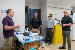 From left, Rice bioengineering faculty member Jordan Miller speaks to Rice Provost Reggie DesRoches, Bioengineering Department Chair Gang Bao and Dean of Engineering Luay Nakhleh during a July 16 tour at Miller's Houston-based startup Volumetric.