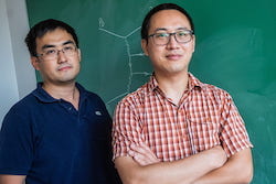 Rice University physics professor Wei Li (left) and postdoctoral research associate Shuai Yang teamed with colleagues at the Large Hadron Collider's (LHC) Compact Muon Solenoid experiment to study matter-generating collisions of light that occurred in heavy ion experiments at LHC. Yang lead-authored a newly published study that detailed how the departure angle of debris from the smashups is subtly distorted by quantum interference patterns prior to impact. The findings will help physicists accurately interpret future experiments aimed at finding "new physics" beyond the Standard Model. (Photo by Jeff Fitlow/Rice University)